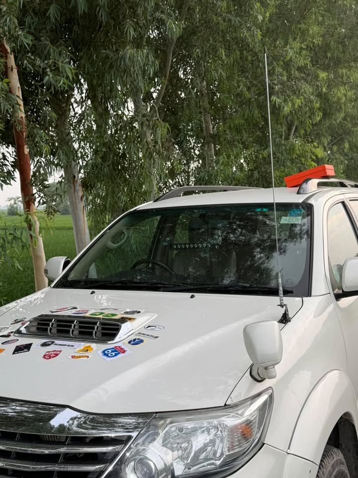 Automotive stickers displayed on a white SUV